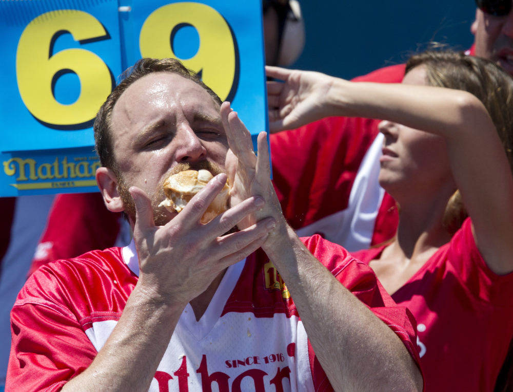 Joey "Jaws" Chestnut competes in Nathan's Famous Fourth of July International Hot Dog Eating Contest men's competition Monday in New York.