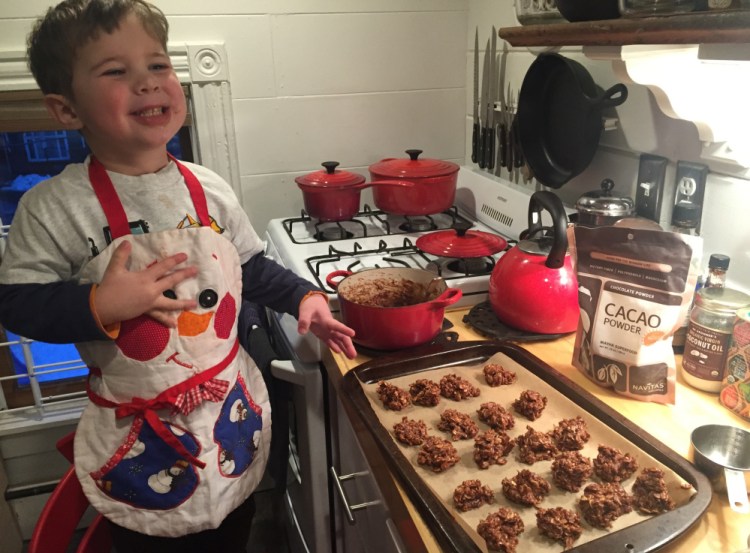 No longer a baby, this giant vegan toddler likes to help in the kitchen. Here, he helps make vegan no-bake cookies from maple syrup, raw cacao powder and rolled oats.
