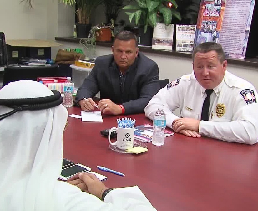 Avon Police Chief Richard Bosley, right, and Mayor Bryan Jensen apologize to Ahmed al-Menhali, after he collapsed following an encounter with police in Avon, Ohio. Al-Menhali's treatment outside a hotel in Avon, Ohio, became front-page news in the Emirates, a key U.S. ally that is home to the commercial hub of Dubai, and prompted the federation's government to formally summon a U.S. diplomat for an explanation.