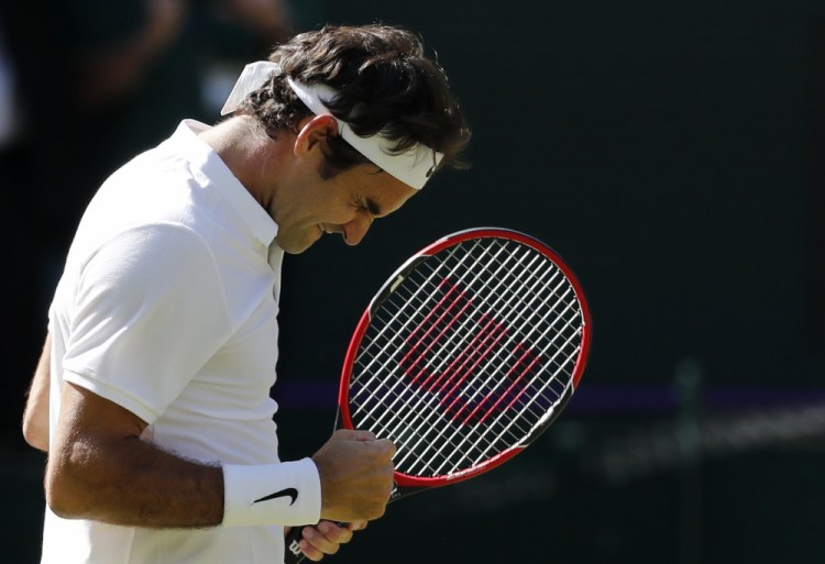 Roger Federer of Switzerland celebrates at match point after beating Marin Cilic of Croatia in their men's singles match on day ten of the Wimbledon Tennis Championships in London Wednesday.