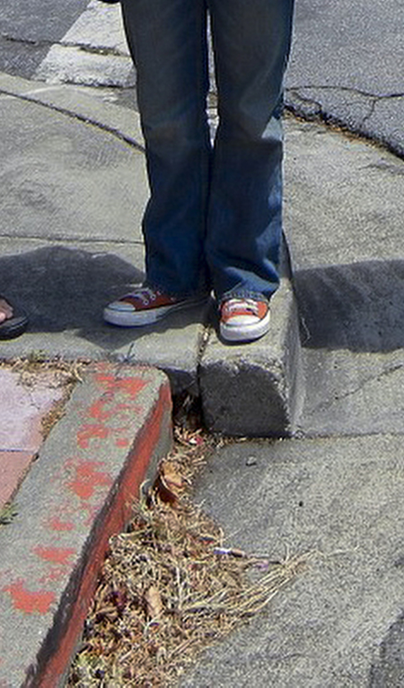 This 2012 photo shows the offset of a curb illustrating seismic forces underneath a Bay Area neighborhood in Hayward, Calif., where geologists had studied the site for years.