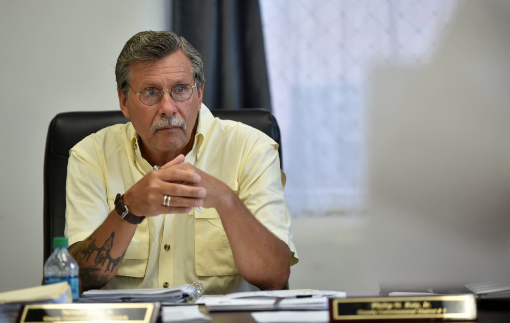 Newell Graff Jr., county commissioner of District 4, listens to a discussion about aid for the private roads destroyed by heavy rain in the unorganized territory in the Commissioner's Chambers at the Somerset County Superior Court House in Skowhegan on Wednesday. Graf said the owners of the private roads should be responsible for repairs.