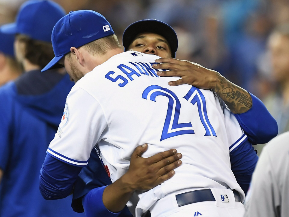 Starting pitcher Marcus Stroman, right, and designated hitter Michael Saunders celebrate the Toronto Blue Jays' 4-2 win over Kansas City on Wednesday.