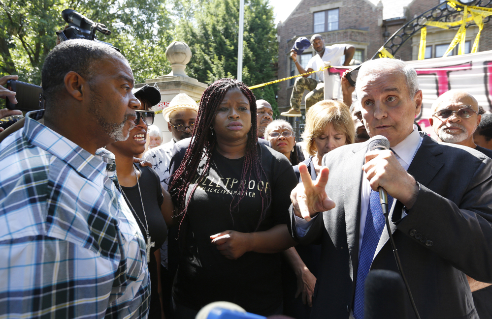 Minnesota Gov. Mark Dayton speaks with Diamond Reynolds, second from left, during a press conference Thursday at his residence regarding the death of Philando Castile. Also at left is Clarence Castile, Castile's uncle, and Nekima Levy-Pounds, center. Dayton called for a federal investigation of the police shooting.
Leila Navidi/Star Tribune via AP