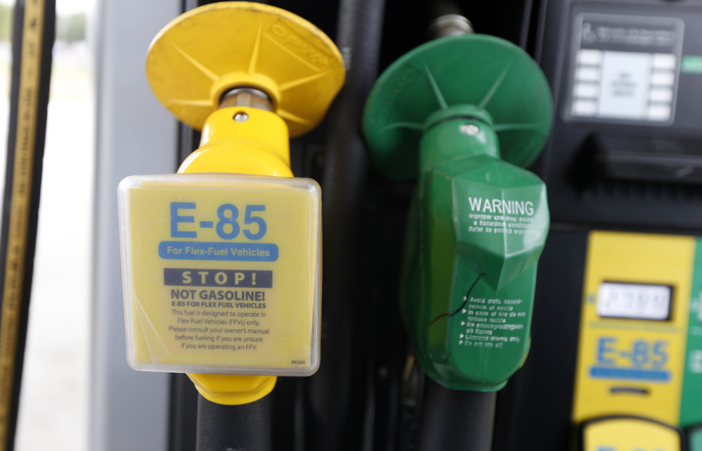 Nozzles for E-85, left, an ethanol fuel blend, and traditional gas are seen at a gas station in Batesville, Miss., in 2014. Ethanol has been a major part of the U.S. energy mix since 1908.