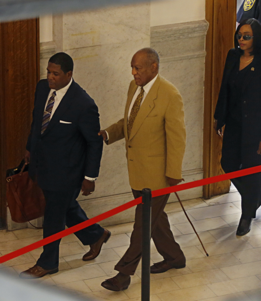 Bill Cosby, center, arrives for a pretrial hearing in his criminal sex assault case at the Montgomery County Courthouse in Norristown, Pa., on Thursday.