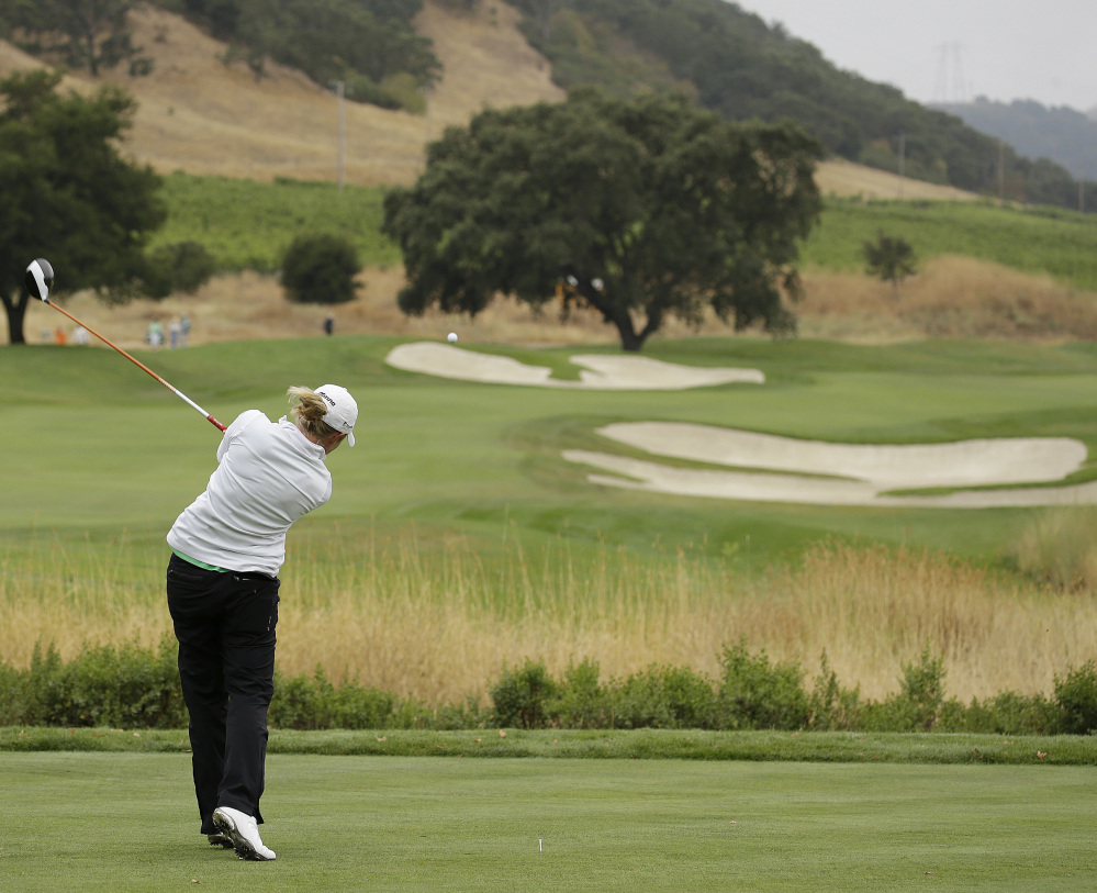 Stacy Lewis follows her drive from the second tee during the first round of the U.S. Women's Open golf tournament at CordeValle, Thursday, July 7, 2016, in San Martin, Calif. ()