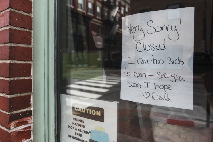 A sign in the door at Marcy's Diner closed says the business is closed because its owner is ill.