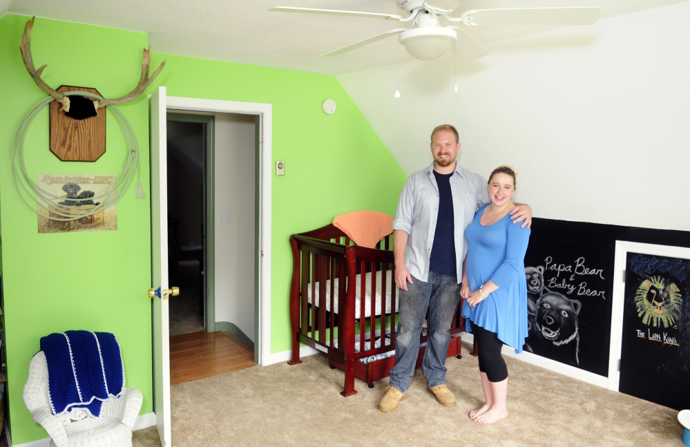New homeowners Steven and Abby Utecht stand in the nursery of their new home Friday in Richmond.