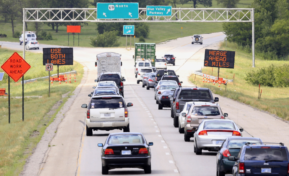 Drivers head into a construction zone in Overland Park, Kan., on Thursday. Kansas and Missouri officials hope to manage heavy construction seasons by encouraging drivers to wait as long as possible before merging during lane closures – and then stagger their flow.