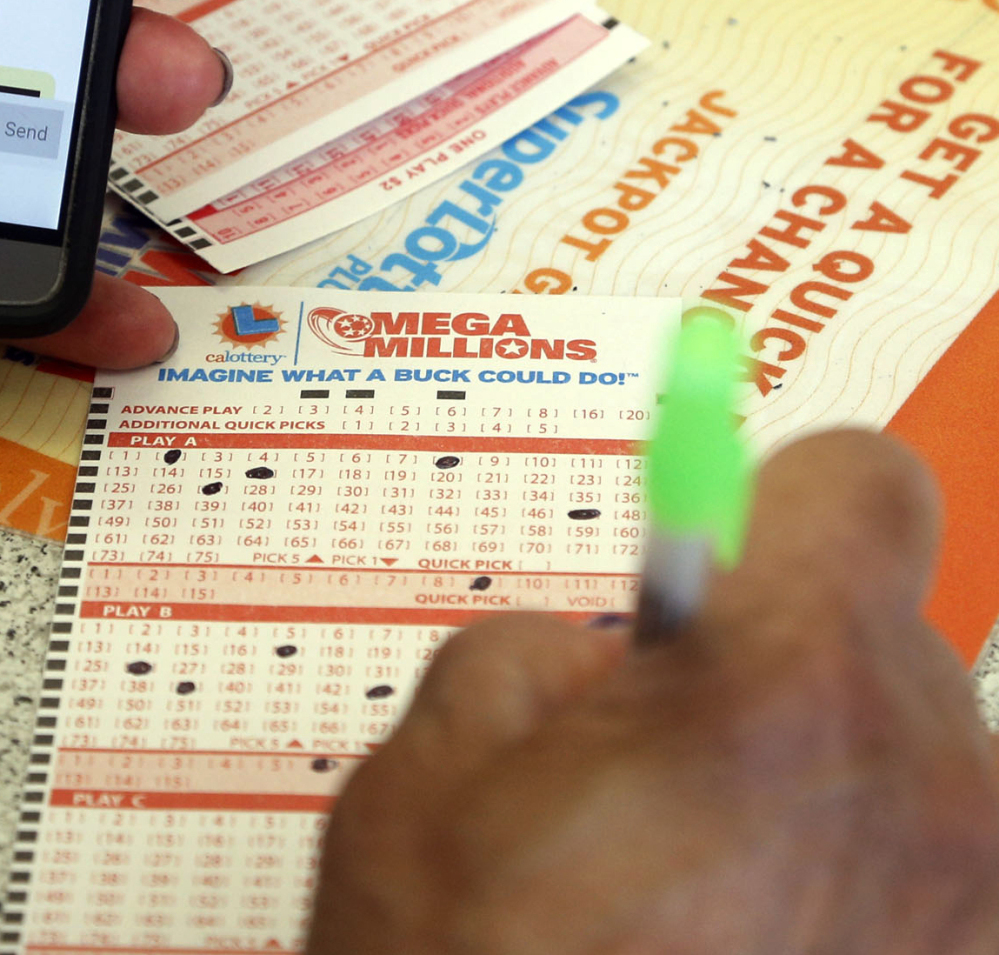 A winner's as-yet-unclaimed jackpot ticket worth $540 million was bought at a gas station in Cambridge City, Ind.