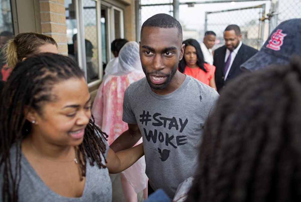 Black Lives Matter activist DeRay McKesson walks out of the Baton Rouge jail Sunday in Louisiana.