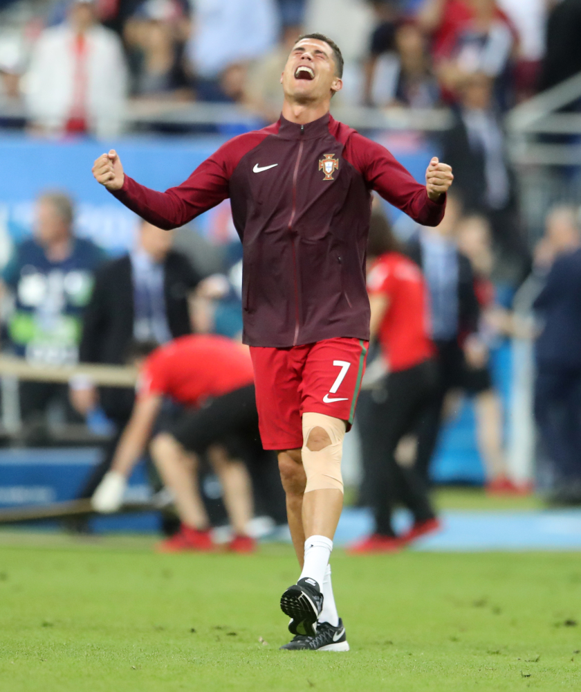 Portugal's Cristiano Ronaldo celebrates at the end of the Euro 2016 final soccer match between Portugal and France at the Stade de France in Saint-Denis, north of Paris, Sunday, July 10, 2016. Portugal won the match 1-0. (AP Photo/Petr David Josek)