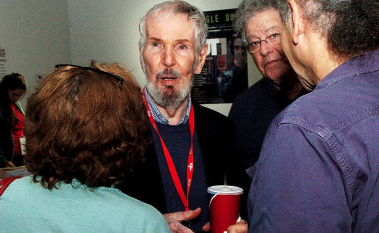 Film Director Robert Benton, center, speaks with Lea Girardin and Abba Lessing in the lobby of the Railroad Square Theater in Waterville on Sunday. Benton, this year's Maine International Film Festival Lifetime Achievement award winner, introduced his film "The Late Show."