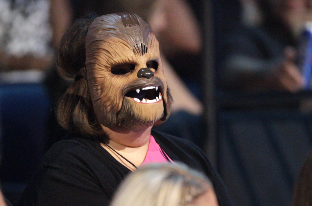 Candace Payne, also known as "Chewbacca Mom, appears in the audience wearing her Chewbacca mask at the CMT Music Awards at the Bridgestone Arena in Nashville, Tenn. Payne posted a video on Facebook of her singing Michael Jackson's "Heal the World" in response to last week's fatal shootings of police officers in Dallas.