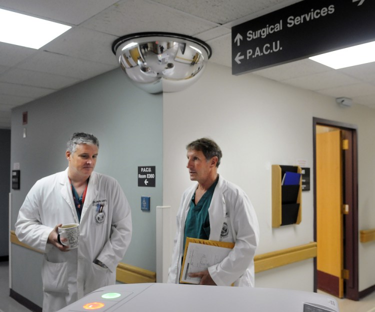 Dr. William Curtis, left, and Dr. Cameron McKee speak Monday on the surgical floor of the VA Maine Healthcare System hospital at Togus during a tour.
