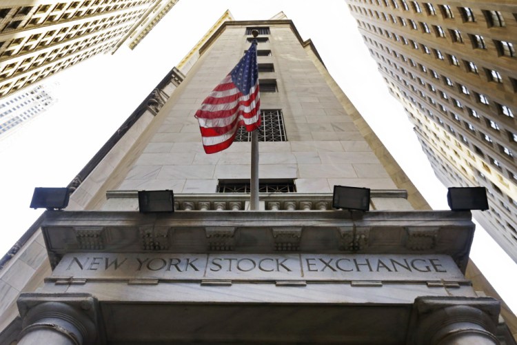 Stocks traded high on Wall Street on Tuesday, with the Dow Jones industrial average closing at a record level.