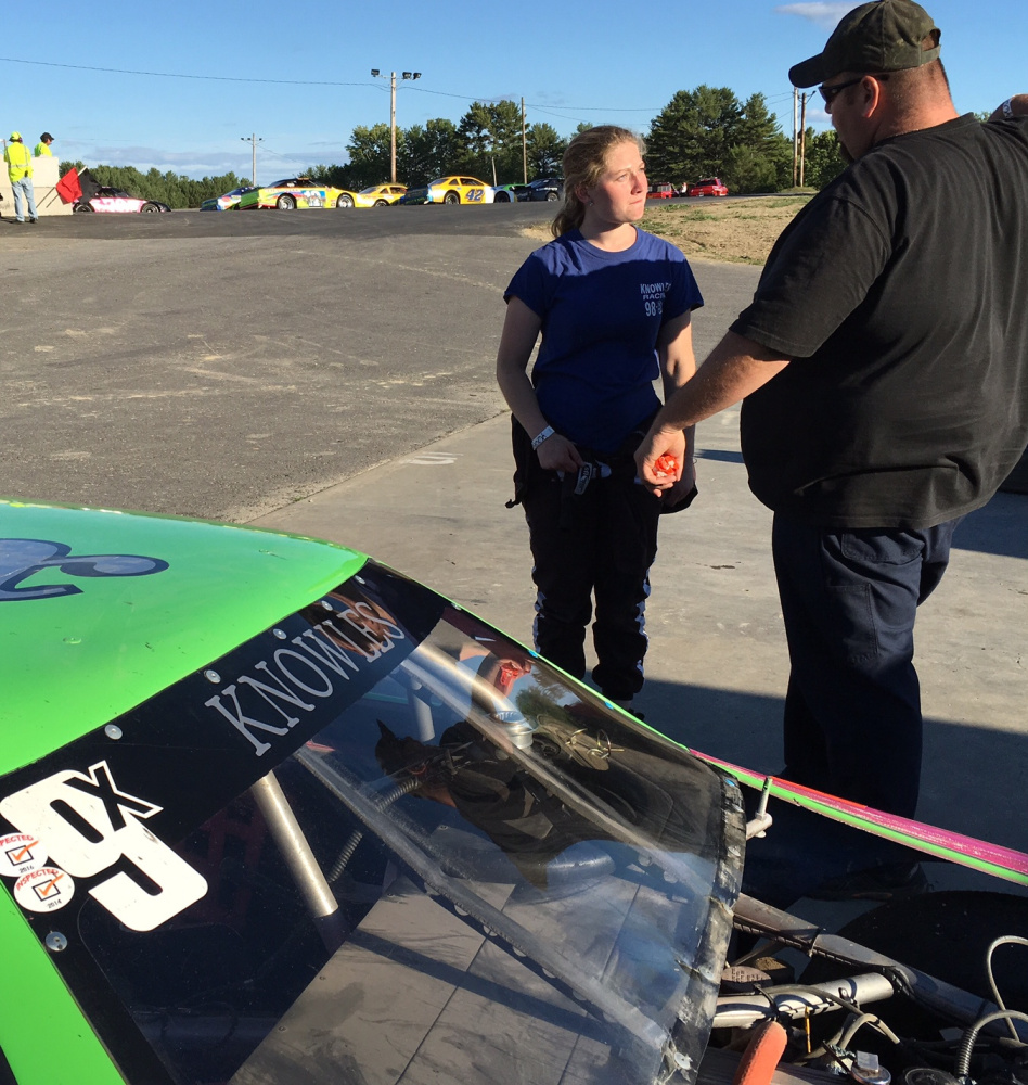 Brooke Knowles, left, of Readfield, talks with crew chief Maurice Young, of Chelsea, prior to a race at Wiscasset Speedway on July 2.