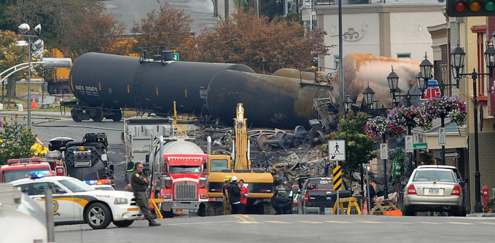 Crude oil tankers from the Montreal, Maine & Atlantic Railway are seen July 9, 2013 in the heart of downtown Lac-Megantic, Quebec, where the runaway train exploded, killing 47.