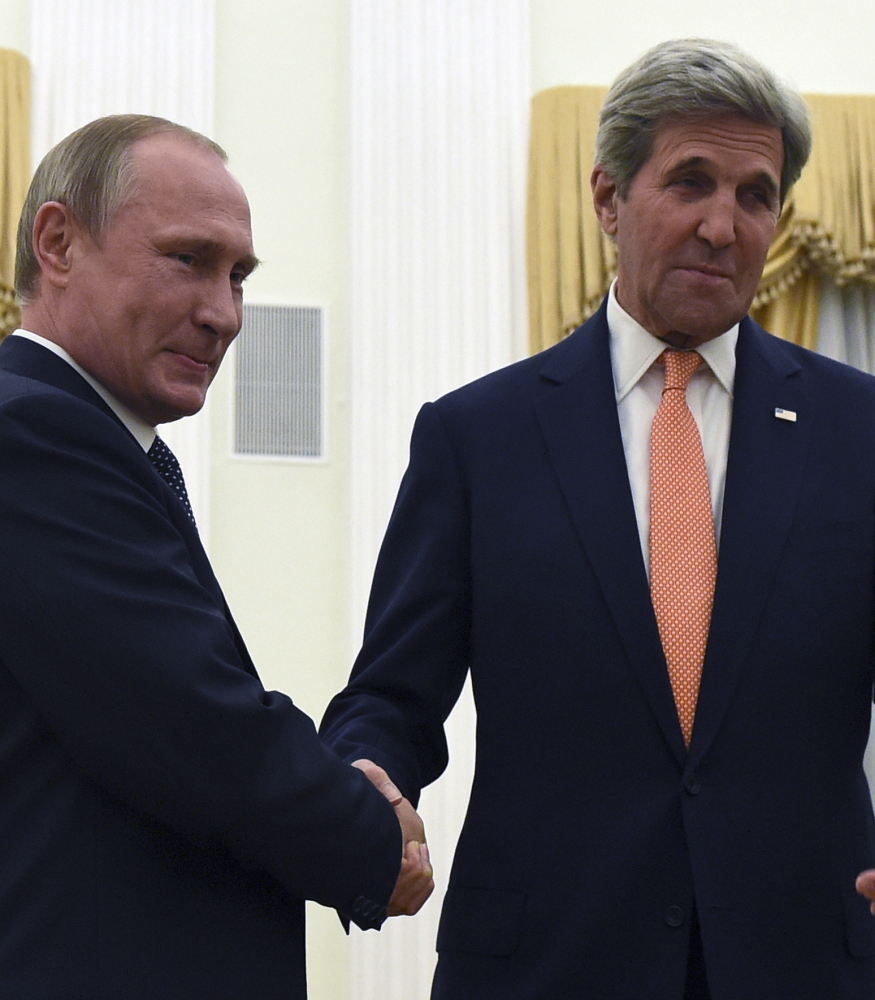 Russian President Vladimir Putin, left, and U.S. Secretary of State John Kerry meet Thursday in Moscow.
