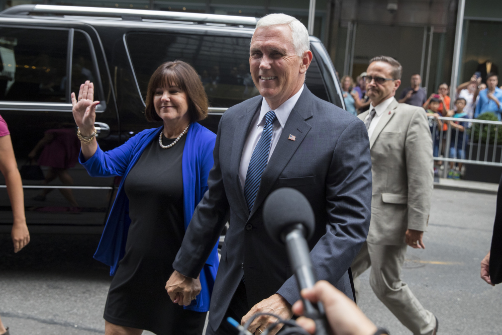 Indiana Gov. Mike Pence and his wife Karen arrive to meet with Republican presidential candidate Donald Trump at Trump Tower in New York on Friday. Trump has chosen Indiana Pence as his running mate, adding political experience and conservative bona fides to his Republican presidential ticket.