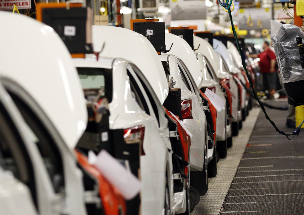 In this April 6, 2016, photo, an assembly line of new 2016 Altimas await backseat installations at the Nissan Canton Vehicle Assembly Plant in Canton, Miss. On Friday, July 15, 2016, the Federal Reserve reports on U.S. industrial production for June. (AP Photo/Rogelio V. Solis)