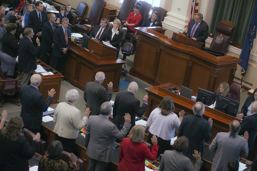 Gov. LePage administers the oath of office to newly elected legislators at the State House in Augusta in 2014. In Maine, dark money spending jumped from just $16,000 in 2006, the last election before the Citizens United decision, to $1.6 million in 2014.