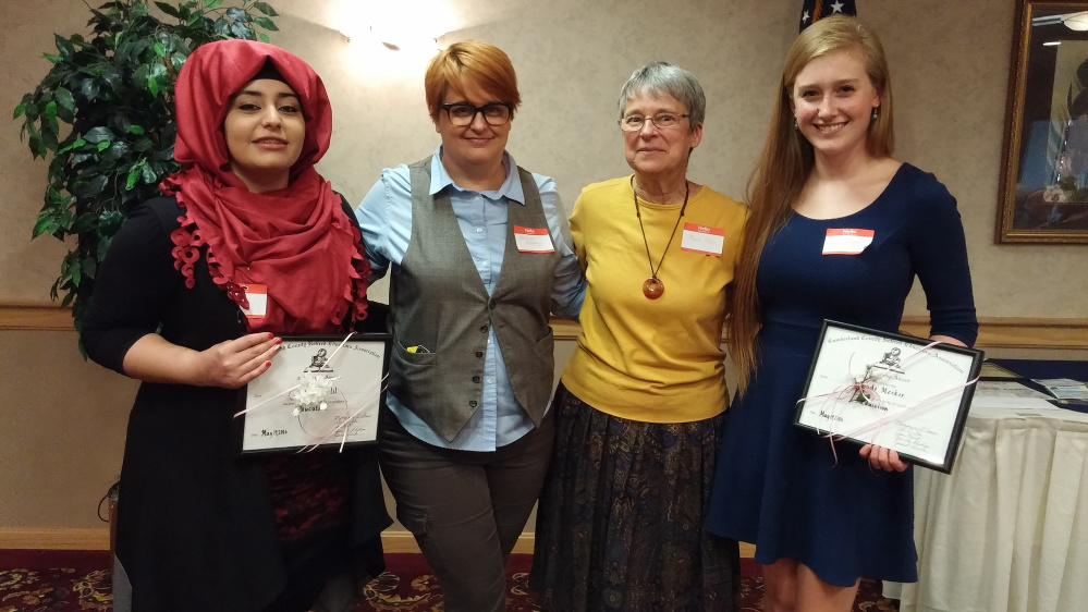 Doaa Khalil, left, of Westbrook High School, and Maude Meeker, right, of Bonny Eagle High School recently received scholarships from CCREA, presented by Marianne Pillsbury, second from left, and Muriel Allen.