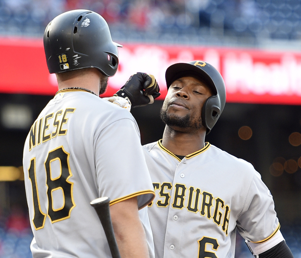 Starling Marte, right, celebrates his home run with Jonathon Niese in the 18th inning of the Pirates' 2-1 win over the Nationals in Washington.