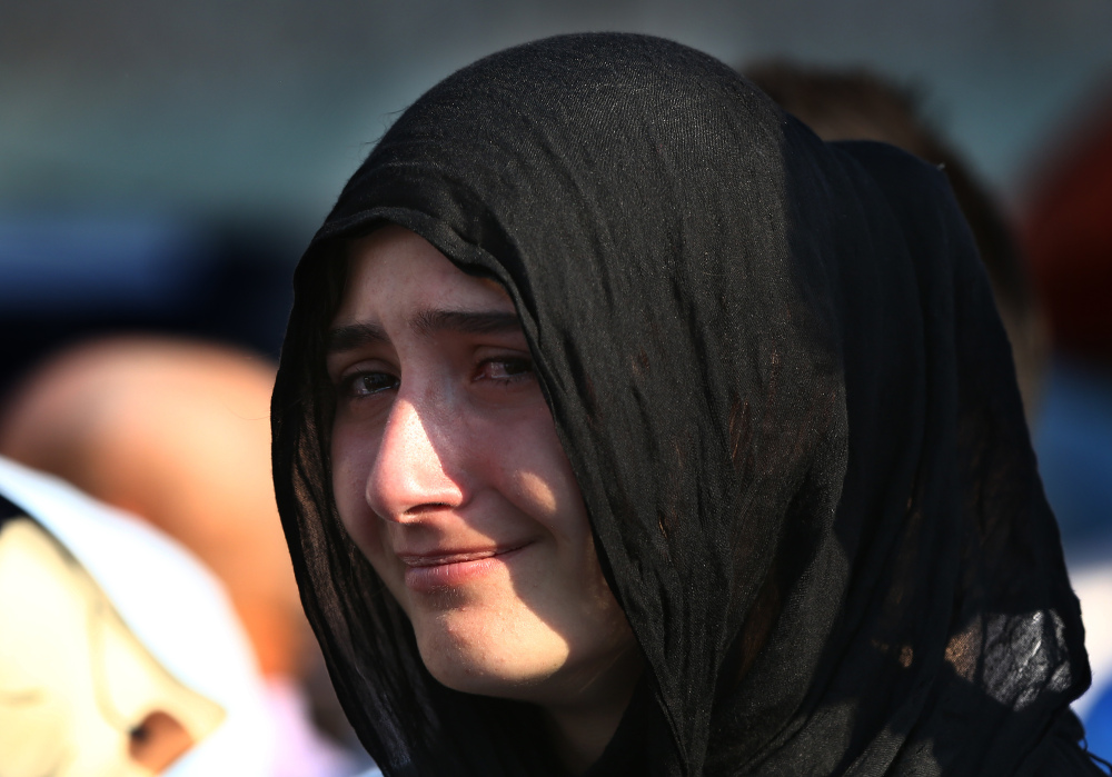 A Turkish woman cries Monday at a mass funeral of policemen killed Friday in the failed military coup.