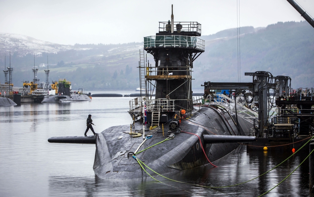 The Vanguard-class submarine HMS Vigilant, one of four Royal Navy submarines armed with Trident missiles, is shown at HM Naval Base Clyde, also known as Faslane, Scotland. British lawmakers voted Monday to replace the country's fleet of nuclear-armed submarines.