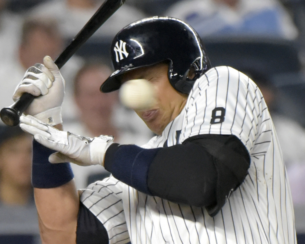 Alex Rodriguez of the New York Yankees grimaces as he tries to avoid an inside pitch during a 2-1 win over the Baltimore Orioles on Monday at Yankee Stadium.