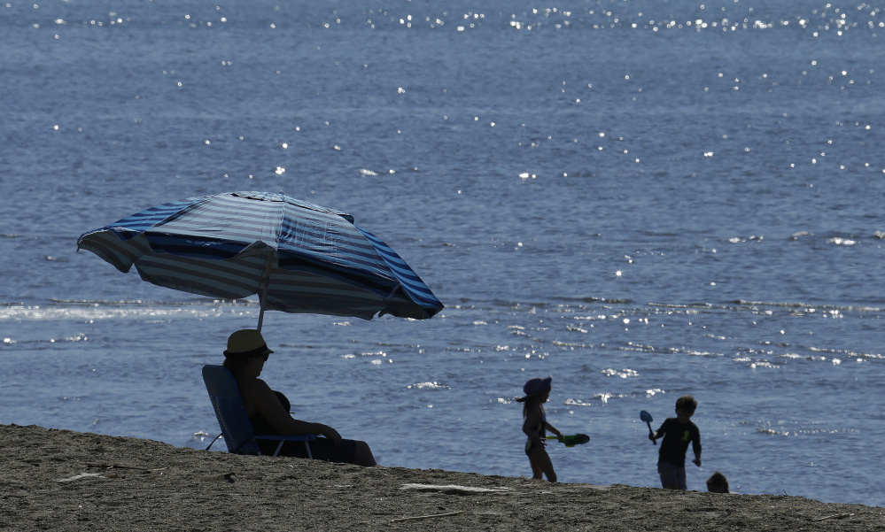 People try to cool off in Alameda, Calif., on Feb. 16. According to the National Oceanic and Atmospheric Administation, June was the 14th straight record hot month globally.