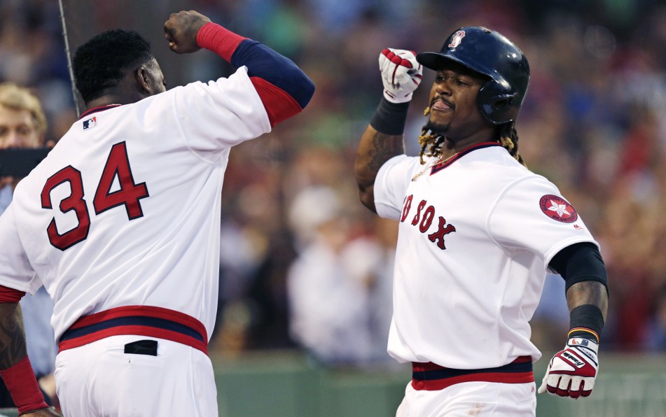 Hanley Ramirez is congratulated by David Ortiz after his two-run home run in the third inning Wednesday night at Fenway Park. Ramirez also hit a two-run homer in the second and later added a two-run blast in the sixth inning against the Giants.