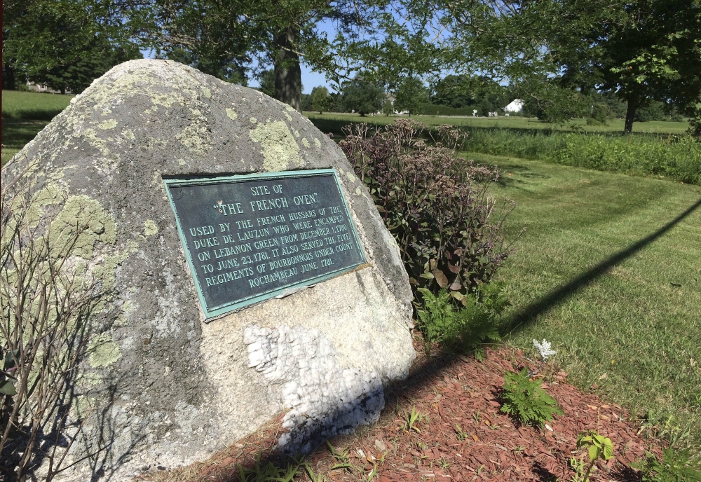 A monument marks the spot on the town green in Lebanon, Conn., where French troops camped during the Revolutionary War. The milelong green has remained much as it was during the 18th century in part because of a court decision that gives ownership of the entire green to the "heirs and assigns" of 51 original deed holders.