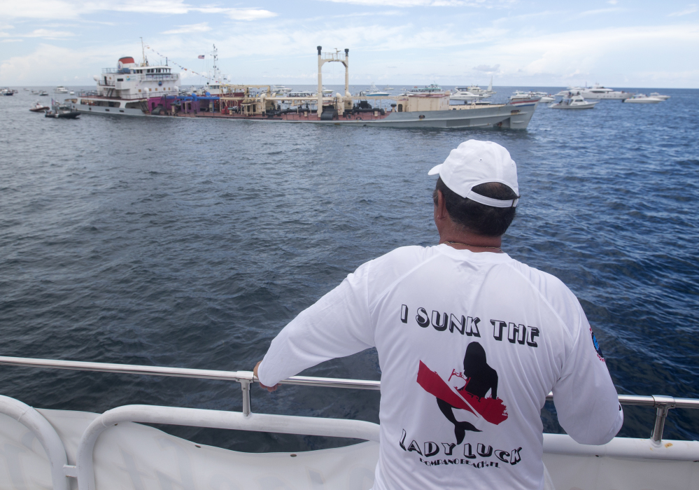 Dennis MacDonald, whose artwork adorns the 324-foot tanker Lady Luck, looks on as it is prepared to be sunk for an artificial reef off the shores of Pompano Beach, Fla.