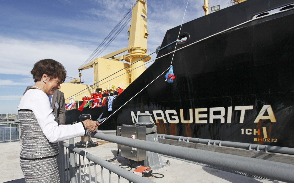 Marguerita DeLuca of  prepares to cut the rope for the christening of the MV Marguerita at the Ocean Gateway Terminal in Portland in July 2016.