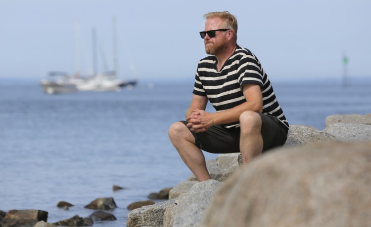 Christopher Betjemann, gazes out at Biddeford Pool on Monday. He will join a sailing expedition to the Arctic Ocean with several missions in mind.