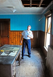 Fire Chief Mike Grant looks at his former office in the 1899 section of the building during a tour on Wednesday of the Hallowell fire station.