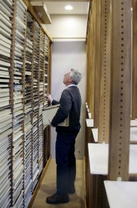 New Bedford Whaling Museum senior maritime historian Michael Dyer combs through the racks of whaling vessel log books in New Bedford, Mass.