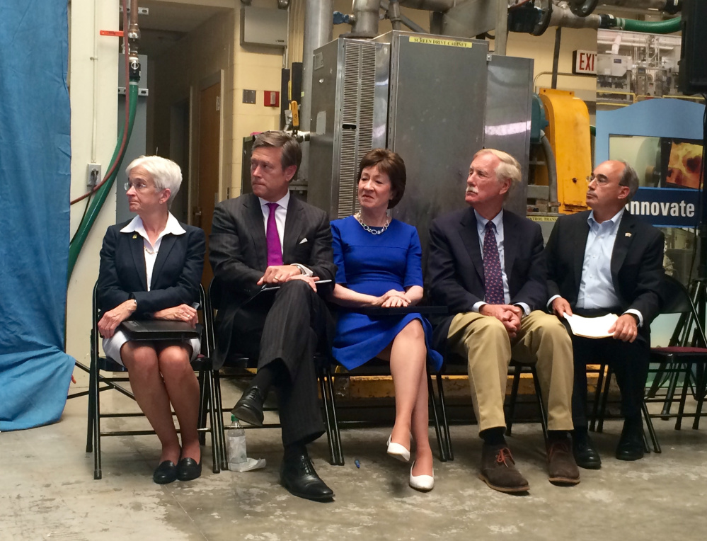 From left to right, University of Maine President Susan Hunter; Matt Erskine, U.S. Deputy Assistant Director of Commerce for Economic Development; U.S. Sen. Susan Collins; U.S. Sen. Angus King and U.S. Rep. Bruce Poliquin listen to remarks at a press conference Friday announcing plans for the federal government to invest in and assess the state's forest products industry. Staff photo by Rachel Ohm.