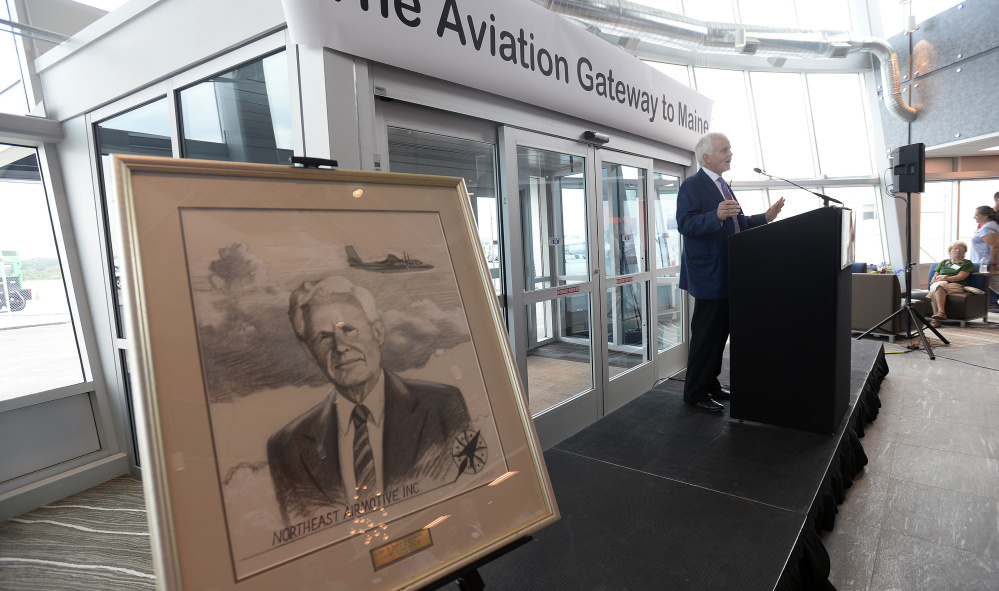 Henry Laughlin III, owner and president of Northeast Air, speaks Friday as his company unveils its new private facility at the Portland International Jetport.