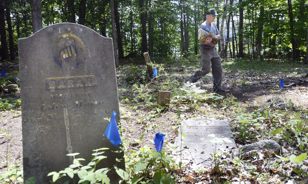 Ken Mann of the Mann Cemetery Association works at the Freeport cemetery. The association wants improved access to the site. "Just because you have a back door doesn't mean you don't want a front door," Mann said.