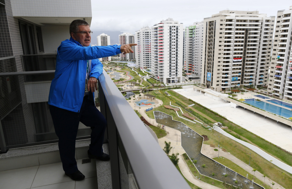 Tomas Bach, President of the International Olympic Committee, looks out from his balcony after moving into his room in the Olympic village in Rio de Janeiro, Brazil, Thursday. 
Ivan Alvarado/Pool Photo via AP