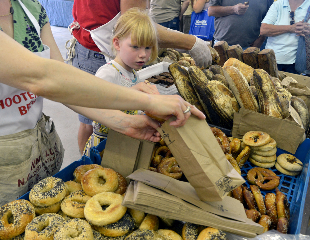 Little Francis DeGeer gets a rise from the many baked goods on display Saturday at the Maine Artisan Bread Fair in Skowhegan, where scores of vendors attracted some 2,500 people from Maine and elsewhere.