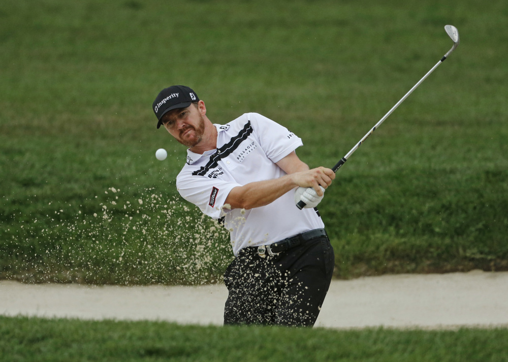 Jimmy Walker hits from a sand trap on the 10th hole during the third round of the PGA Championship on Sunday at Baltusrol Golf Club in Springfield, N.J.