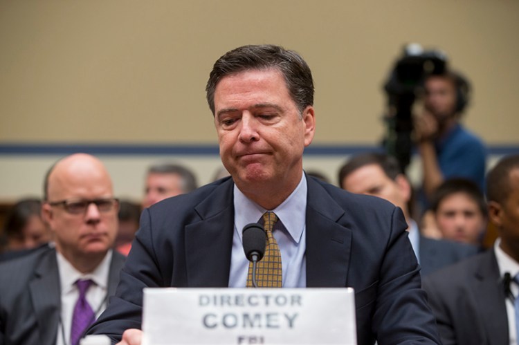 FBI Director James Comey pauses while testifying the House Oversight Committee on Thursday, July 7.