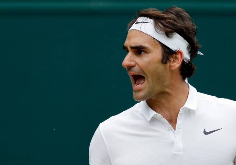 Roger Federer of Switzerland reacts during his men's semifinal singles match against Milos Raonic of Canada on day twelve of the Wimbledon Tennis Championships in London, Friday, July 8, 2016. 