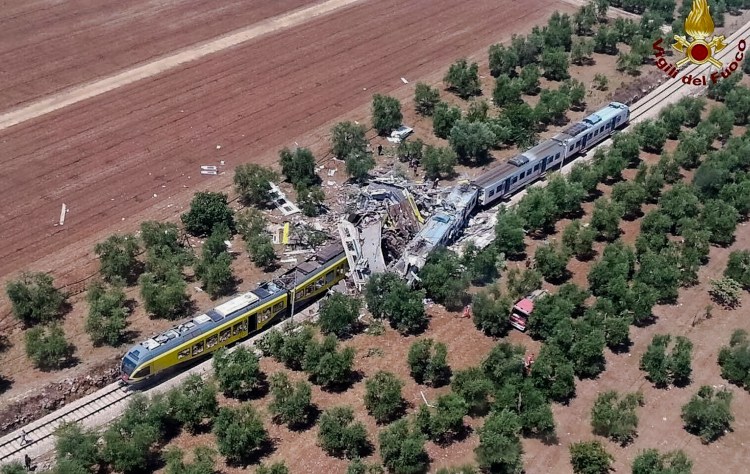 This aerial handout photo shows what is left of two commuters trains after their head-on collision in the southern region of Puglia, Tuesday, July 12, 2016. (Italian Firefighter Press Office via AP)