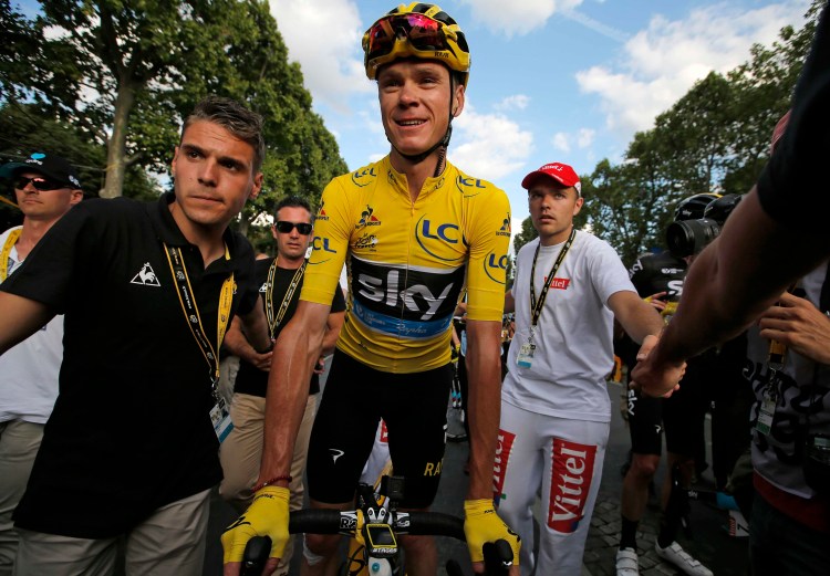 Britain's Chris Froome, the 2016 Tour de France champion, wears the overall leader's yellow jersey after finishing the 21st stage of the Tour de France in Paris on Sunday. Associated Press/Christophe Ena